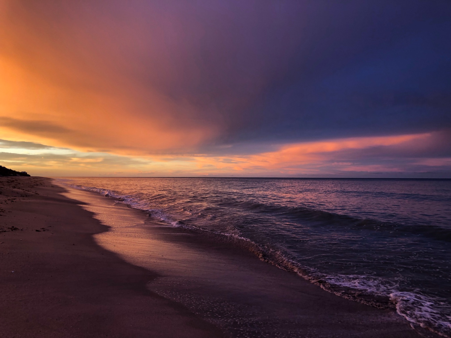 Orange and purple evening light over the Vero shoreline
